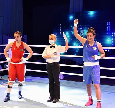 India's Pooja Rani celebrates her 5-0 win against Mavluda Movlonova of Uzbekistan to secure gold in women's 75 kg category match at the ASBC Asian Boxing Championships 2021. (Photo | PTI)