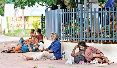 Desititue people resting by the road | b p deepu