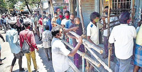 Throwing caution to the wind, local residents throng a TASMAC shop at Puliyanthope in Chennai on Thursday | P Jawahar