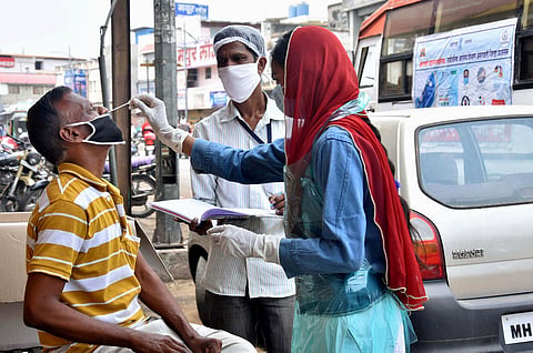 A health worker collects samples for COVID-19 testing, amid surge in coronavirus cases, Maharashtra. (File Photo | PTI)