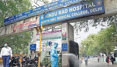 Health workers spray disinfectants at the Hindu Rao Hospital in New Delhi. (File Photo | Parveen Negi, EPS)