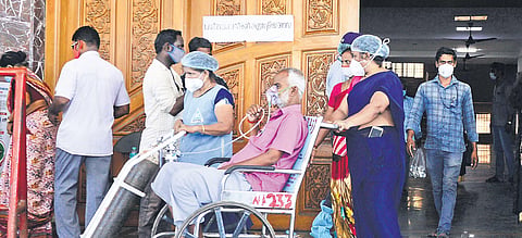 A patient is wheeled out of the Corona Outpatient Department at RGGGH in Chennai on Saturday. (Photo | Debadatta Mallick/EPS)