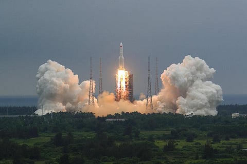 Long March 5B rocket carrying a module for a Chinese space station lifts off from the Wenchang Spacecraft Launch Site. (Photo | AP)