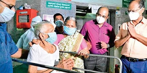 Janakiyamma thanks doctors as she gets discharged from Pariyaram Medical College Hospital.