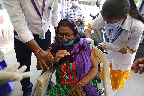 A physically disabled woman gets a dose of Covishield, Serum Institute of India's version of the AstraZeneca COVID-19 vaccine. (Photo | AP)