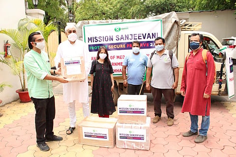 Chhattisgarh health minister TS SInghdeo receiving medical supplies from representatives of Oxfam India. (Photo | Twitter)