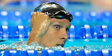 Caeleb Dressel reacts after winning his heat in the men's 100 freestyle during wave 2 of the US Olympic Swim Trials in Omaha. (Photo | AP)