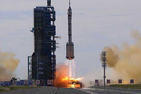 A Long March-2F Y12 rocket carrying a crew of Chinese astronauts in a Shenzhou-12 spaceship lifts off at the Jiuquan Satellite Launch Center. (Photo | AP)