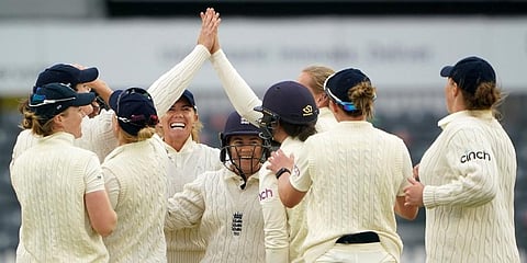 England's Amy Jones celebrates after taking a wicket from India's Sneh Rana on day three of the Women's International Test match at the Bristol County Ground. (Photo | AP)
