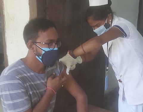 A youth being vaccinated in Bihar.