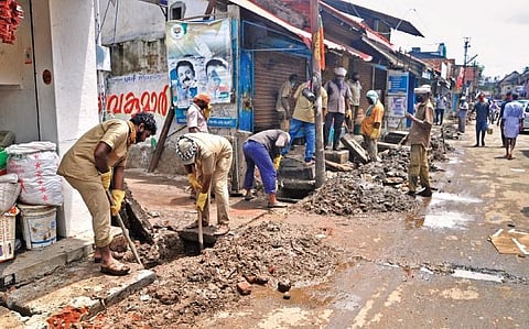 Corporation workers carry out pre-monsoon cleaning activities at Chalai Market in Thiruvananthapuram on Wednesday.