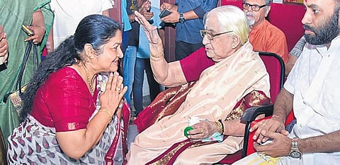 Playback singer K S Chitra seeking the blessings of Carnatic music legend Parassala Ponnammal during the release of the latter’s documentary in the capital | file pic