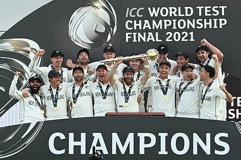 New Zealand's captain Kane Williamson (C) lifts the winner's Mace as players celebrate victory of the World Test Championship against India at Ageas Bowl, Southampton, England on June 23. (Photo | AFP