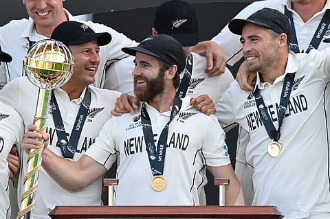 New Zealand's captain Kane Williamson (C) holds the winner's Mace as teammates celebrate winning World Test Championship at Ageas Bowl, Southampton, England on June 23, 2021. (Photo | AFP)