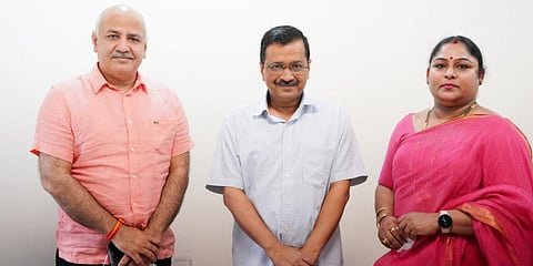 CM Arvind Kejriwal and deputy CM Manish Sisodia with Delhi Sports University V-C Karnam Malleswari. (Photo| Twitter)