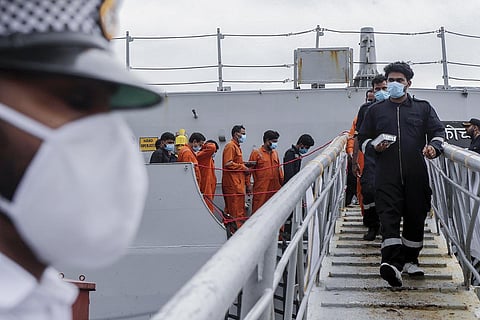 People rescued by the Indian Navy from a barge and tugboat Varaprada that sank in the Arabian sea (Photo | AP)
