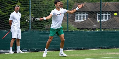 Novak Djokovic and his coach Goran Ivanisevic on the practice courts prior to the Wimbledon Tennis Championships in London. (Photo | AP)
