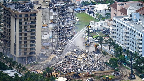 Rescue personnel work at the remains of the Champlain Towers South Condo in Surfside, Fla., on Friday, June 25, 2021. (Photo | AP)