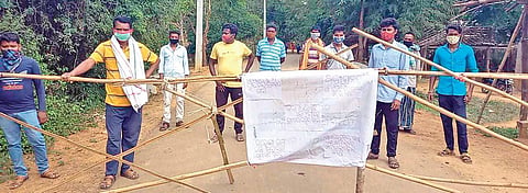 Youths barricading the village road at Balenga in Nabarangpur. (Photo| EPS)