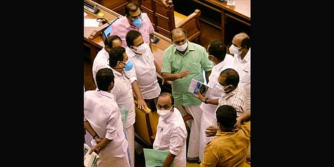Finance Minister K N Balagopal talks to Opposition legislators after the budget on Friday | Vincent Pulickal