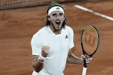 Stefanos Tsitsipas of Greece celebrates after defeating Russia's Daniil Medvedev during their quarterfinal match of the French Open. (Photo | AP)