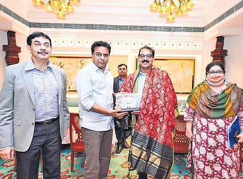 Industries Minister K T Rama Rao presents a memento to Kitex Group CMD Sabu Jacob during a meeting in Hyderabad on Friday