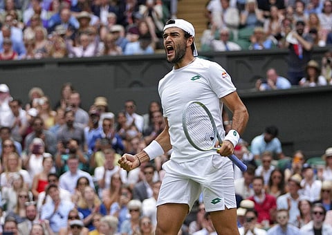 Italy's Matteo Berrettini celebrates after defeating Poland's Hubert Hurkacz during the men's singles semifinals match on day eleven of the Wimbledon. (Photo | AP)
