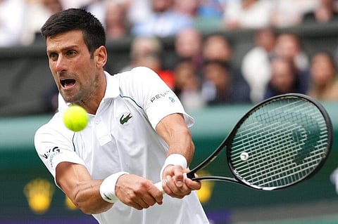 Serbia's Novak Djokovic plays a return to Canada's Denis Shapovalov during the men's singles semifinals match on day eleven of the Wimbledon. (Photo | AP)