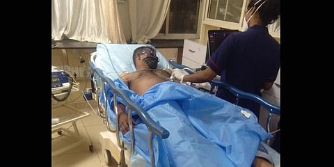 Radhakrishna in the hospital after the alleged assault by the police.