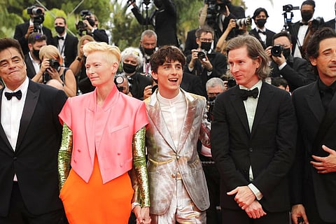 Benicio Del Toro, from left, Tilda Swinton, Timothee Chalamet, director Wes Anderson, and Adrien Brody pose upon arrival at Cannes film festival, France, July 12, 2021. (Photo | AP)