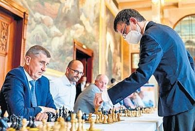 Grand Master David Navara making a move against Prime Minister of the Czech Republic, Andrej Babiš| Prague Chess Society
