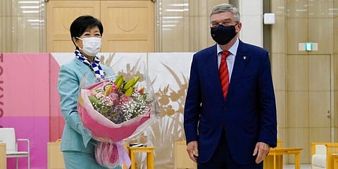 Tokyo Governor Yuriko Koike (L) and International Olympic Committee President Thomas Bach pose for photos prior to their meeting in Tokyo. (Photo | AP)