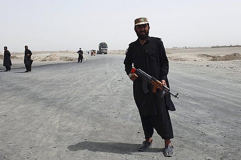 Pakistani paramilitary soldiers stand guard near Pakistan Afghan border crossing following fighting between Afghan security forces and Taliban in SpinBoldak border area. (Representational Photo | AP)