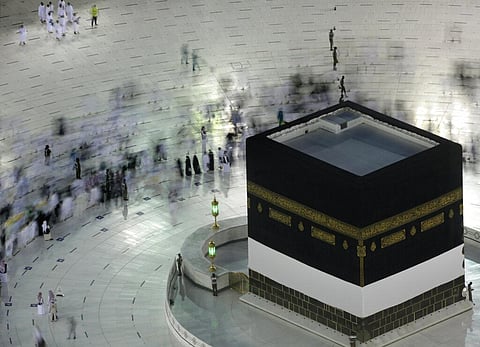 In this photo taken with low shutter speed, Muslim pilgrims circumambulate the Kaaba, the cubic building at the Grand Mosque, at the start the annual hajj pilgrimage. (Photo | AP)