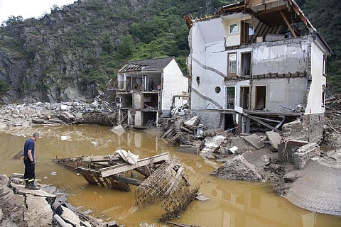 A fireman stands in front of a completely destroyed house in the village of Mayschoß, Germany. (Photo | AP)
