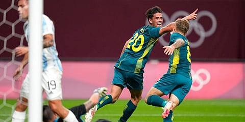 Australia's Lachlan Wales celebrates scoring his side's opening goal against Argentina during a men's soccer match at the 2020 Summer Olympics, Thursday, July 22, 2021, in Sapporo, Japan. (Photo | AP)