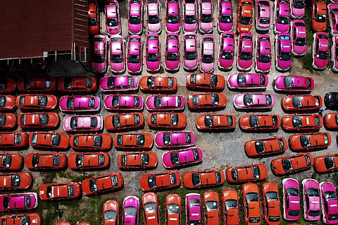 This aerial photo taken on July 20, 2021 shows scores of taxis left in a parking lot, after drivers were unable to pay rent on them due to the economic hardship of Covid-19. (Photo | AFP)
