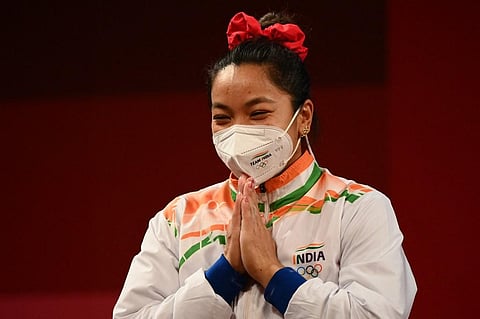 Silver medallist India's Chanu Saikhom Mirabai during the victory ceremony of women's 49kg weightlifting competition during Tokyo Olympic 2020 on July 24, 2021. (Photo | AFP)