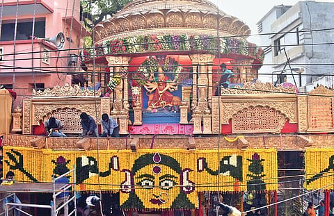 Workers deck up the historic Sri Ujjaini Mahankali Temple in Secunderabad ahead of the Lashkar Bonalu festival, on Saturday