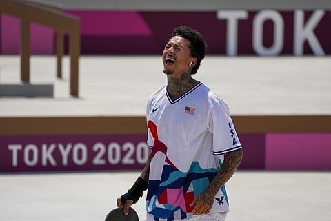 Nyjah Huston of the United States is dejected after falling during a trick in the men's street skateboarding at the 2020 Summer Olympics. (Photo | AP)