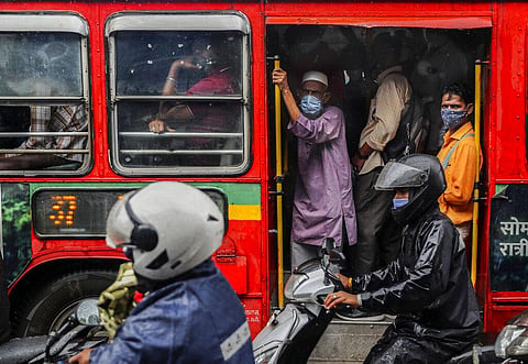 People wearing masks as a precaution against the coronavirus while travelling in a bus in Mumbai, India, Tuesday, July 13, 2021. (Photo | AP)