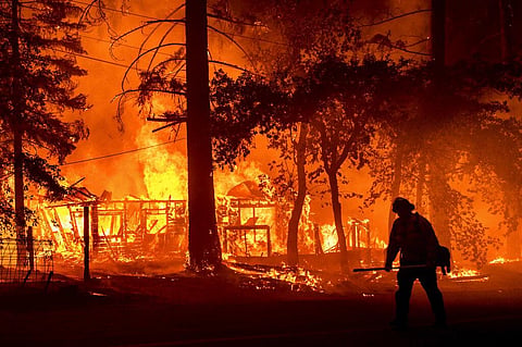 The fire destroyed multiple residences as it tore through the Indian Falls community. (Photo | AP)