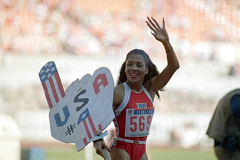 In this Sept. 29, 1988, file photo, Florence Griffith Joyner, of the United States, waves to spectators. (Photo | AP)