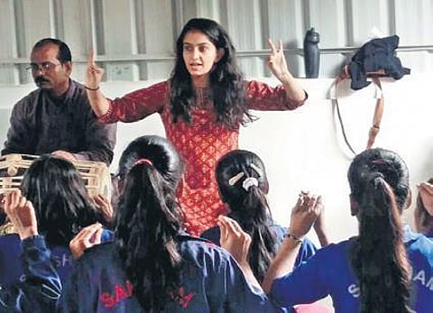 teaching students at Saksham Baal Vikas Sansthan, Gurgaon