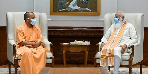 Uttar Pradesh Chief Minister Yogi Adityanath (L) with Prime Minister Narendra Mod. (Photo | ANI Twitter)