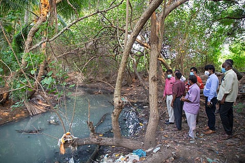 Experts inspecting a drain. (Photo | EPS/G Pattabiraman)