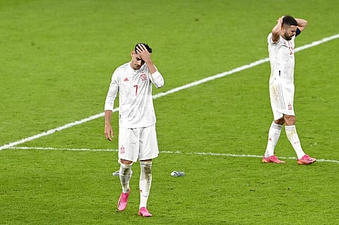 Spain's Alvaro Morata and Jordi Alba, right, react at the end of the Euro 2020 soccer championship semifinal match between Italy and Spain at Wembley stadium. (Photo | AP)