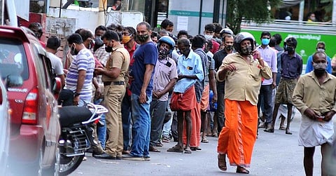 A long queue in front of the liquor outlet at High Court Junction in Kochi. (Photo | A Sanesh, EPS)
