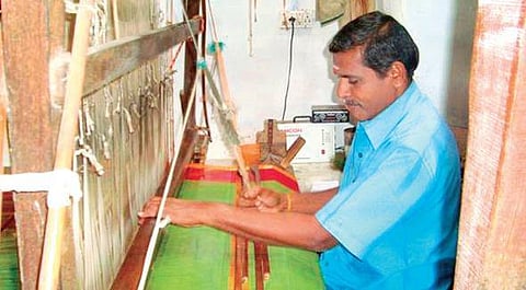 A weaver at work at his handloom