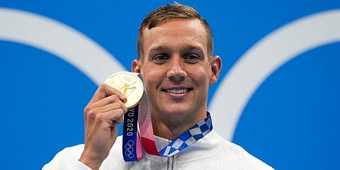 Caeleb Dressel, of United States, poses after winning the gold medal in the men's 50-meter freestyle final at the 2020 Summer Olympics in Tokyo, Japan. (Photo | AP)